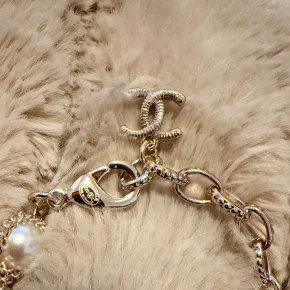 Gold-Tone Pearl Bracelet with Crystallized Logo Pendant - Picture 6 of 7